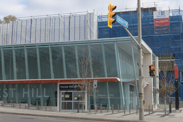 Fototapeta premium exterior building facade and sign of Forest Hill LRT Station located at 842 Eglinton Av W, Toronto