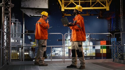 Black engineer performing digital inspection of oil rig platform, monitoring industrial activity...