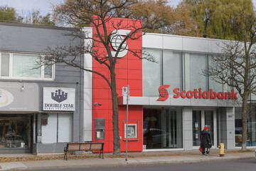 Fototapeta premium exterior building facade and signs of Double Star Games And Hobbies and Scotiabank located on Eglinton Av W, Toronto