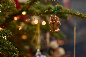 Gingerbread man ornament adds festive charm to a beautifully decorated christmas tree