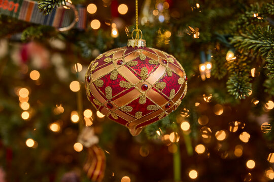 Elegant red and gold christmas ornament adds festive charm to your holiday tree decor