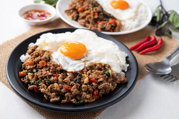 Thai food, Stir fried holy basil with minced pork with cooked rice and fried egg on top