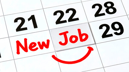 Calendar page highlighting a new job start date with a red marker and a smiling face indicating excitement for the new career opportunity and fresh beginnings on the marked day