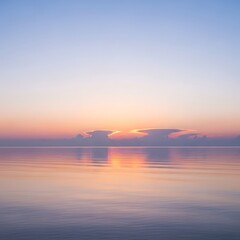 Fototapeta premium Serene Sunset Over Calm Ocean Waters with Faint Clouds.