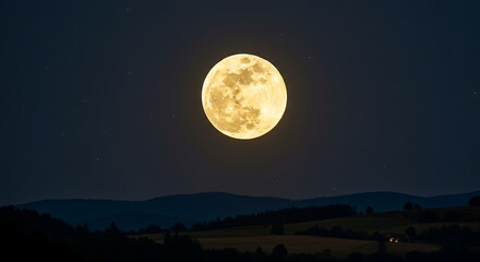 Glowing full moon illuminates a dark night sky, with silhouettes of hills and fields below