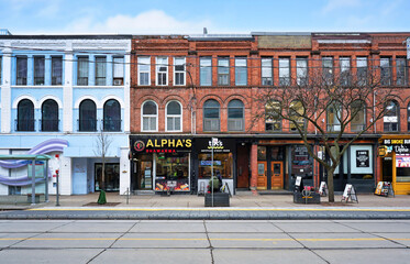 Fototapeta premium Old buildings with stores and restaurants in the trendy west end of downtown Toronto