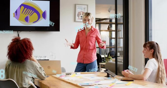 Standing lead opening biz brainstorm speaking gesturing as data overlays moving around screen fish