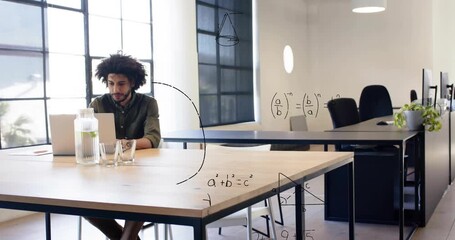 Man at table using laptop, woman entering greeting man, shaking hands, education diagrams emerging - Powered by Adobe