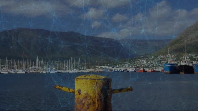 Camera dollying forward, yellow bollard growing closer to reveal rusted texture and coiled rope