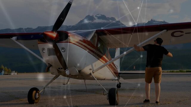 Pilot performing preflight visual checks on right wing and cabin door before boarding aircraft