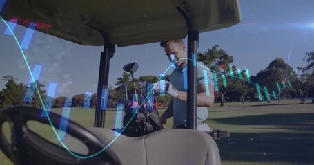 Male golfer approaching cart reaching bag selecting club preparing shot as financial charts overlay - Powered by Adobe