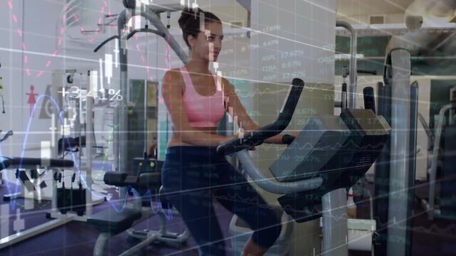 Woman pedaling on bike in gym, starting finance candlesticks overlaying console for metrics