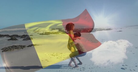 Woman stepping closer causing man lifting woman swaying shore flag overlay rippling romantic travel - Powered by Adobe