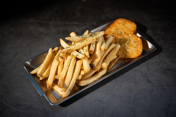 Crispy French Fries and Hash Browns on a Metal Tray