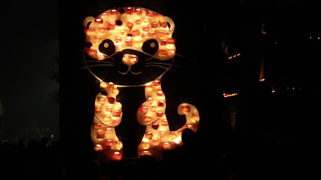Light parade with animal sculptures, cute weasel art