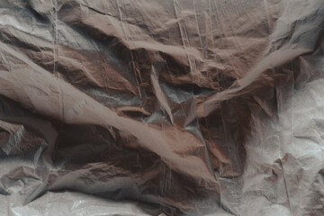 Fabric textured background crumbled and crinkled with lines and shadows