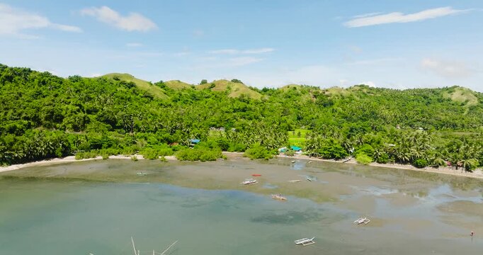 Fishing boats at coastal area. Island with farmland. Santa Fe, Tablas, Romblon. Philippines.