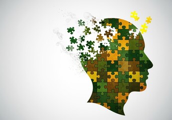 Human head silhouette made of puzzle pieces symbolizing memory and mind