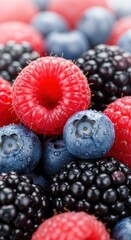 Close up of Fresh Ripe Mixed Berries with Water Droplets