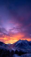 Snowy Mountain Range at Sunset with Vibrant Purple and Orange Sky