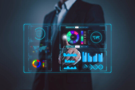 A business professional interacting with a futuristic digital dashboard displaying analytics charts data visualizations, and performance metrics symbolizing data-driven decisions and modern corporate. - Powered by Adobe