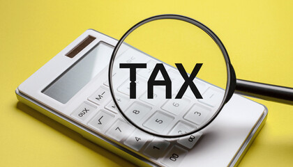 Tax Planning Magnifying Glass on Calculator for Financial Strategy