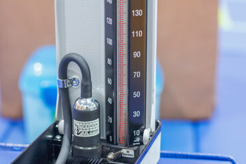 a manual sphygmomanometer showing the mercury scale and tubing. Ideal for medical, healthcare, hospital equipment, diagnostics, and clinical examination concepts.