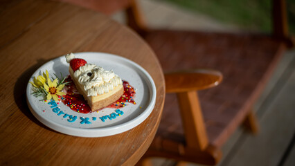 Festive Christmas Cheesecake Slice with Strawberry and Whipped Cream