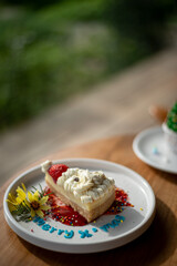 Festive Christmas Cheesecake Slice with Strawberry and Whipped Cream