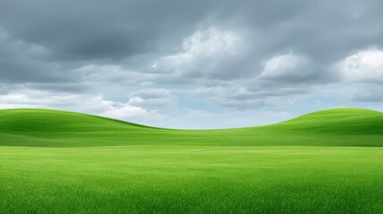 Fototapeta premium Lush Green Hills Under a Dramatic Cloudy Sky with Soft Light and Vibrant Grass, Reflecting Nature's Serenity and Peaceful Atmosphere in a Rural Landscape