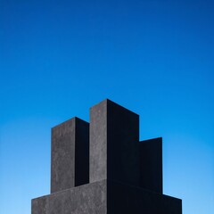 A striking tall building featuring two elegant towers that rise majestically from its rooftop, showcasing modern architectural design against a clear blue sky.
