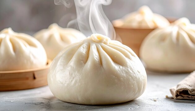 Close-up of a freshly steamed Chinese bao bun with soft, fluffy texture and gentle steam rising, placed on a clean neutral background