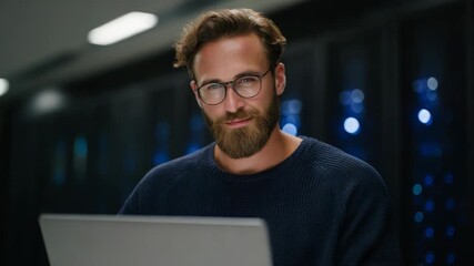Data center technician using laptop in server room for system maintenance - Powered by Adobe