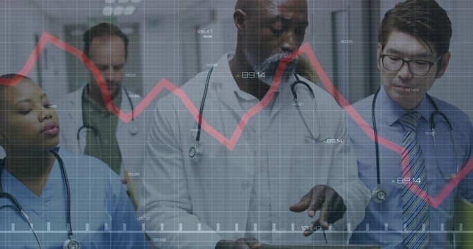 Reviewing five clinicians in coats with stethoscopes holding tablet in hospital corridor, red graph - Powered by Adobe