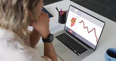 Viewing woman in light blouse leaning at desk, studying NFT laptop red-chart BUY-button, copy space