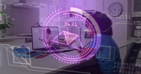 Studying child in blue T-shirt watching remote tutor on laptop at kitchen table, with AR HUD