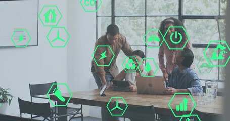 Pointing man leaning over tablet in boardroom, team with laptops in business, eco icons floating