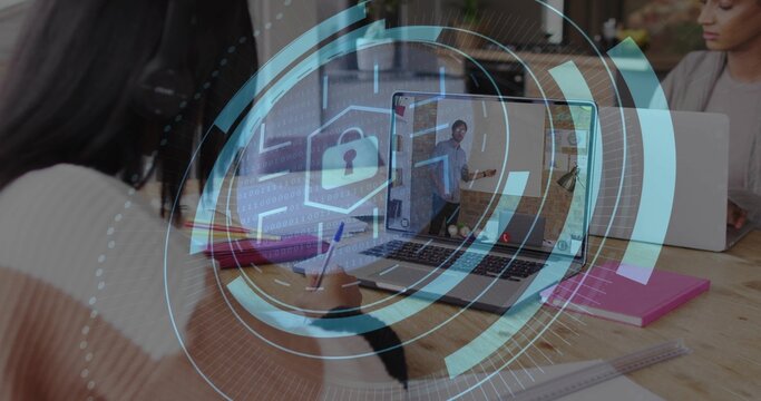 Writing person in striped sweater noting at wooden table with laptop, pink notebook, padlock HUD - Powered by Adobe