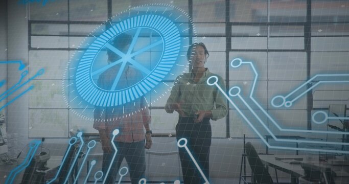 Interacting two male colleagues wearing business-casual at studio, with holographic circular HUD - Powered by Adobe