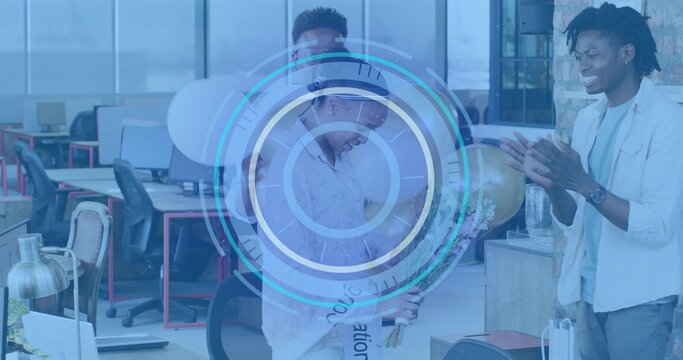 Holding celebrant woman wearing patterned top reacting in open office with bouquet gold balloon HUD