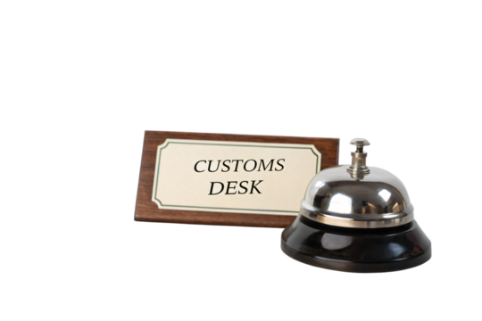 Customs Desk and Service Bell: A close-up view presents a classic metal service bell next to a sign, Customs Desk, symbolizing accessibility and assistance in the world of travel.