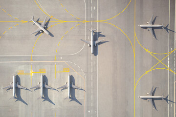 Aerial View of Parked Airplane on Airport Runway © 용석 주