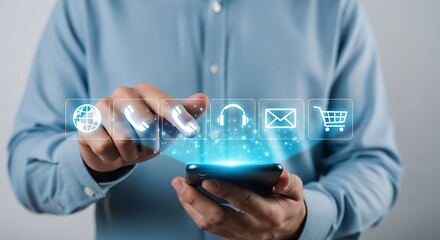 Man using smartphone with holographic icons for online communication.