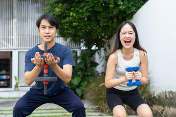 Man lifestyle exercising with dumbbell and weight outdoor fitness training