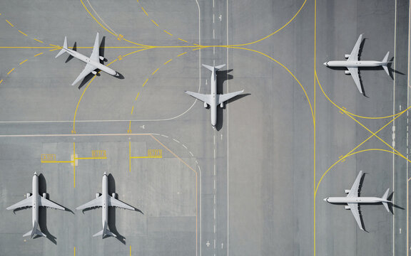 Aerial View of Parked Airplane on Airport Runway