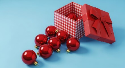 Red christmas ornaments spilling from a festive gift box on blue background