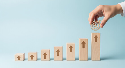 Concept of growth and continuous improvement using wooden blocks step by step towards clear strategic objectives.