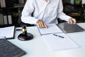 Lawyer businessman working with lawbook in office or courtroom Legal counsel with gavel and legal...