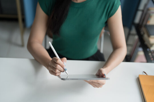 Asian woman Graphic designer working on digital tablet. artist drawing on graphic tablet female Artist Creative Designer sketch graphic drawing creative studying work