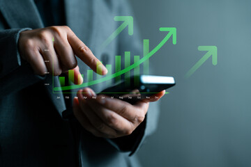 Business growth chart and economic success with digital rising bar graph, profit increase and upward arrow showing financial performance analytics. Person using smartphone to analyze business data.